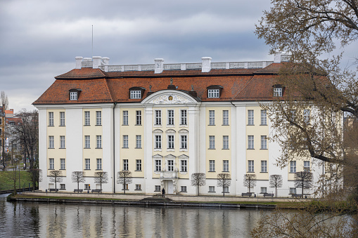 Berlin, Germany - Apr 10th 2022: Köpenick palace in Berlin is a prominent building near Dahme river.