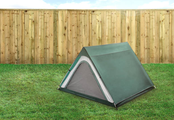 istock Camping tent on a grass in a backyard 1392188742