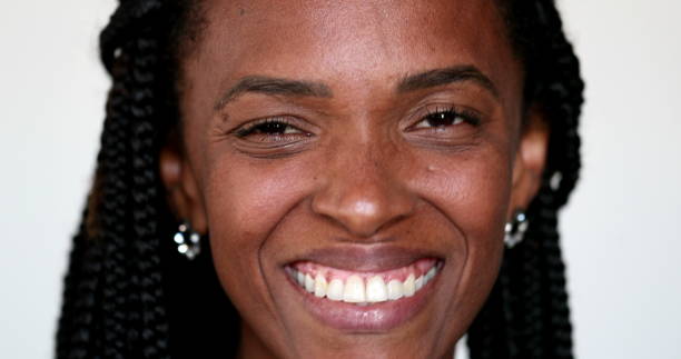 istock African ethnicity woman looking at camera smiling portrait 1392190054