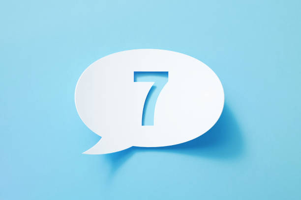 istock Circular  White Chat Bubble With Cut Out Number 7 Sitting On Blue Background 1392190620