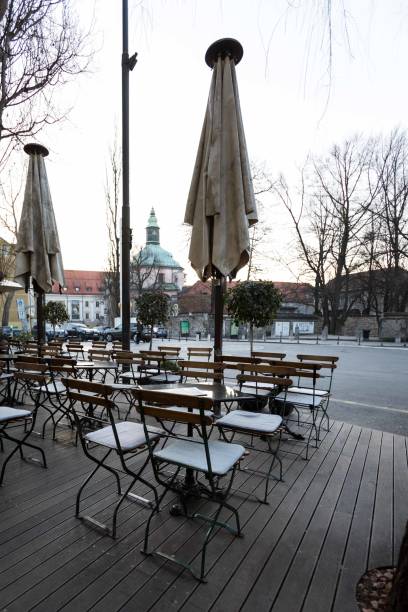 istock Chairs and tables at outdoors cafe terrace 1392191313