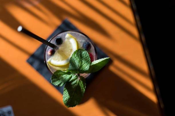 Fresh water with lemon and mint served in a bar.
