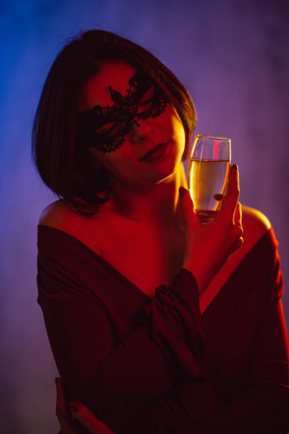 istock Young Woman With A Carnival Mask 1392191500