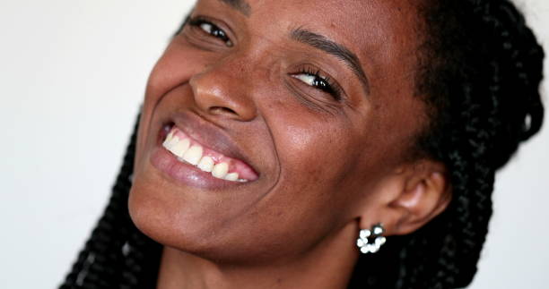 istock African ethnicity woman looking at camera smiling portrait 1392191609