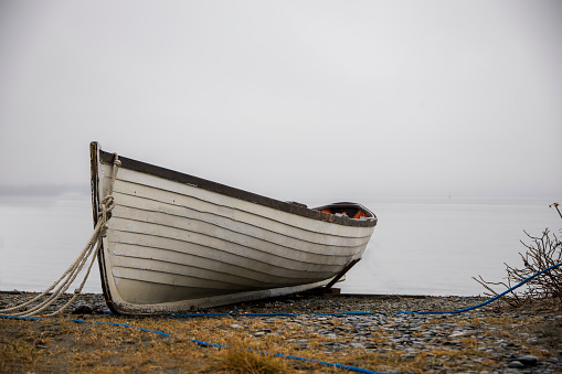 a picture of Wooden boats on the coast near the ocean