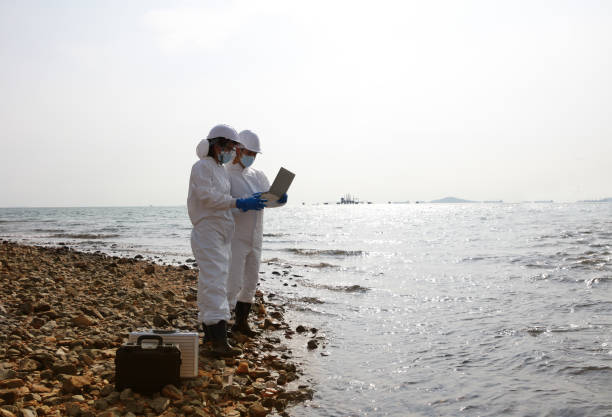 istock Scientist or Biologist wearing PPE protection analyze the waste water from industrial 1392191900