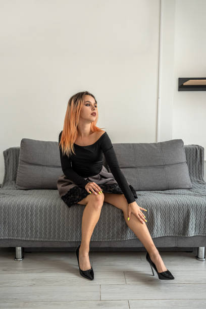 istock young relaxed girl lying on a spacious sofa in the bedroom. 1392194439