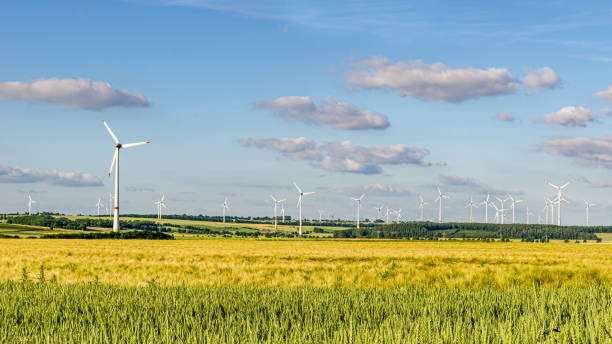 istock Wind turbines in agricultural landscape 1392197359
