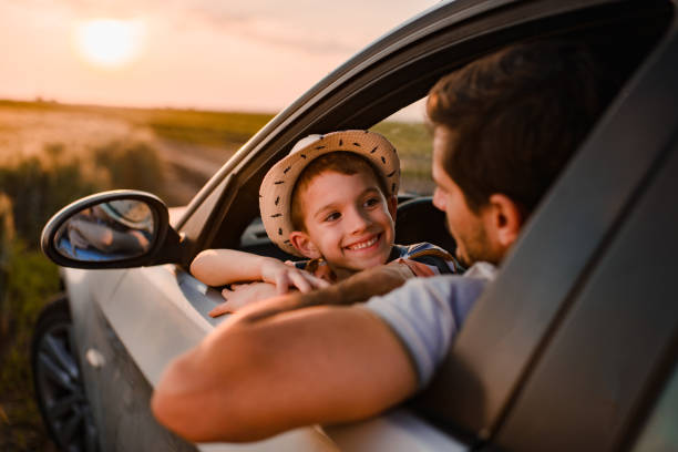 istock Beautiful father and son enjoying on a road trip 1392200593