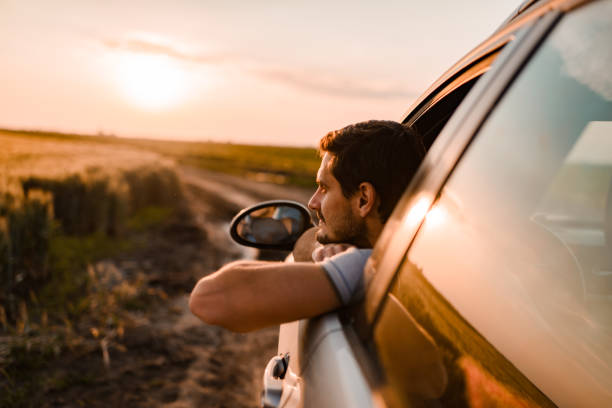 istock Beautiful man enjoying on a road trip 1392200812