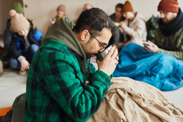 istock Man with Hot Drink in Shelter 1392201929