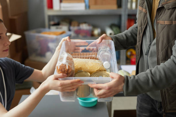 istock Sharing Food at Help Center CloseUp 1392201971