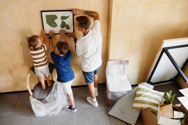 istock Father and Sons Hanging Picture 1392203141