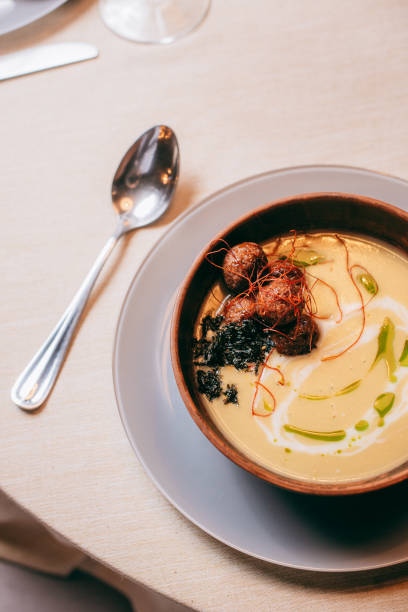 istock Spinach soup with cream in a bowl. Close up. 1392203433