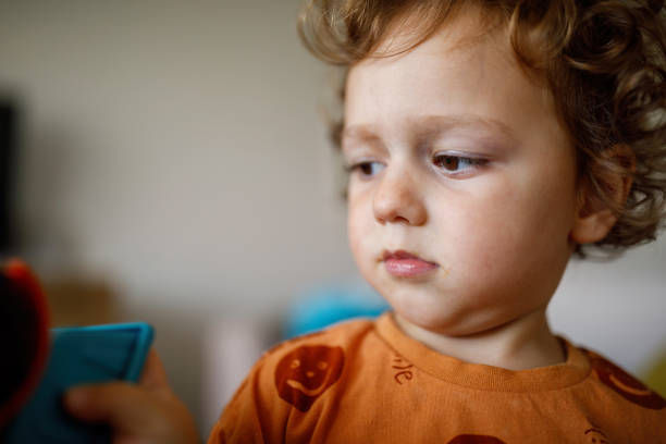 istock Baby boy playing at home 1392204371