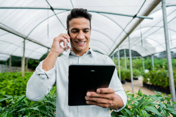 istock Brazilian man working and using technology in the field 1392205106
