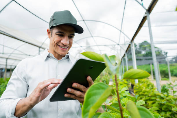 istock Brazilian man working and using technology in the field 1392205111