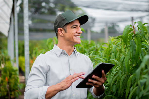 istock Brazilian man working and using technology in the field 1392205213