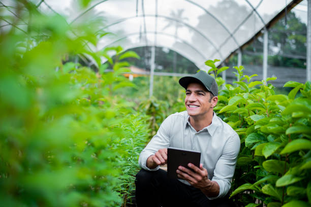 istock Brazilian man working and using technology in the field 1392205249