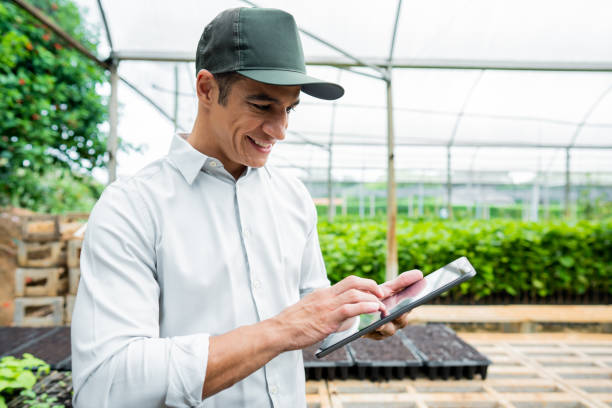 istock Brazilian man working and using technology in the field 1392205316
