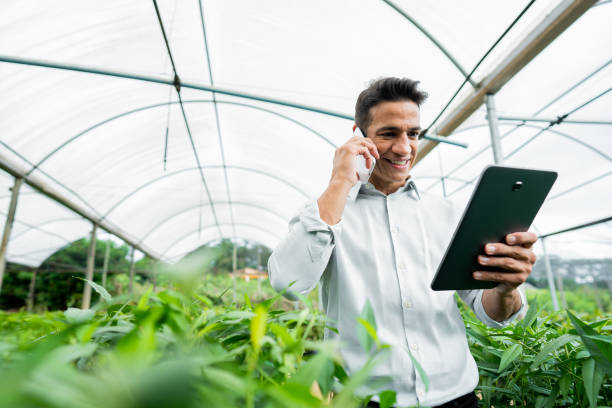 istock Brazilian man working and using technology in the field 1392205436