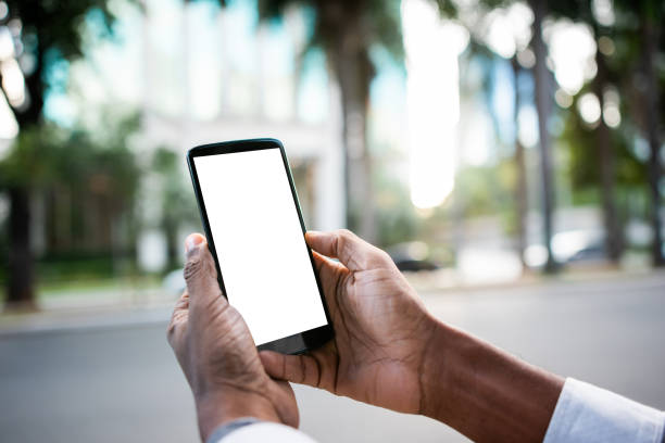 istock Brazilian man working and using technology in the city 1392205620