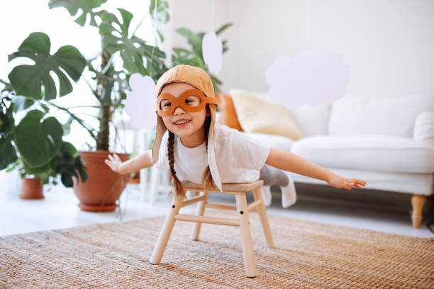 istock Little girl wearing a vintage pilot hat 1392207151