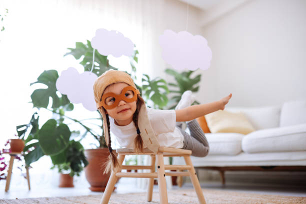 istock Little girl wearing a vintage pilot hat 1392207209