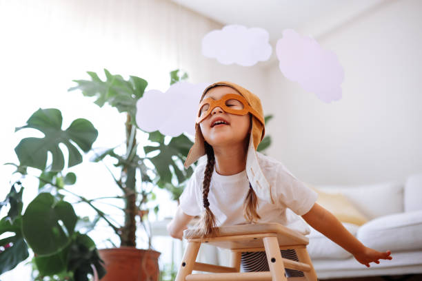 istock Little girl wearing a vintage pilot hat 1392207255