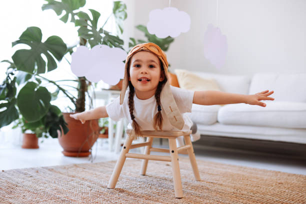 istock Little girl wearing a vintage pilot hat 1392208287