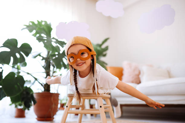 istock Little girl wearing a vintage pilot hat 1392208295