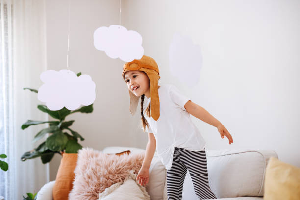 istock Little girl wearing a vintage pilot hat 1392208332