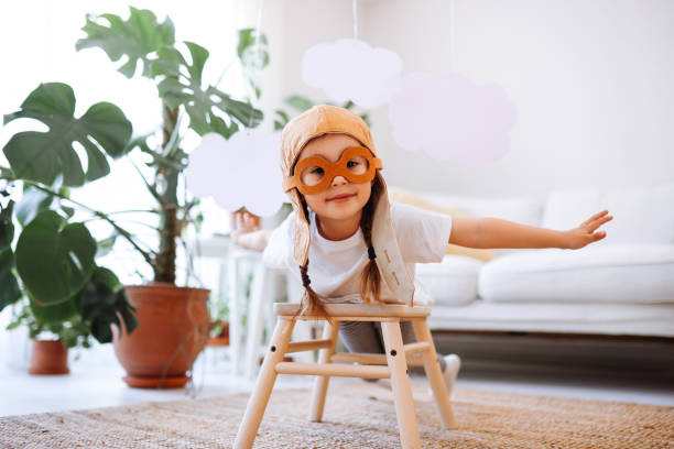 istock Little girl wearing a vintage pilot hat 1392208356