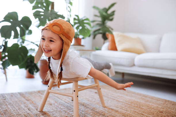 istock Little girl wearing a vintage pilot hat 1392208382