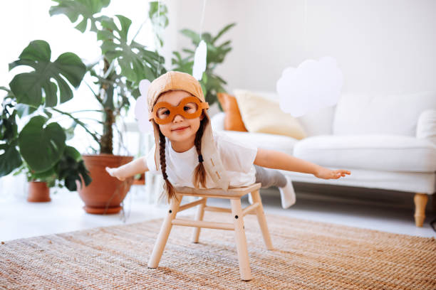 istock Little girl wearing a vintage pilot hat 1392208436