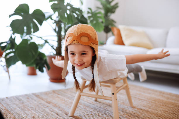 istock Little girl wearing a vintage pilot hat 1392208445