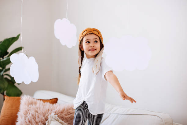 istock Little girl wearing a vintage pilot hat 1392208452