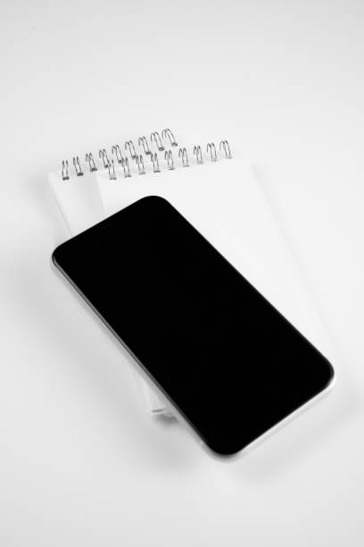 istock Office supplies such as computers on white desktop 1392211153