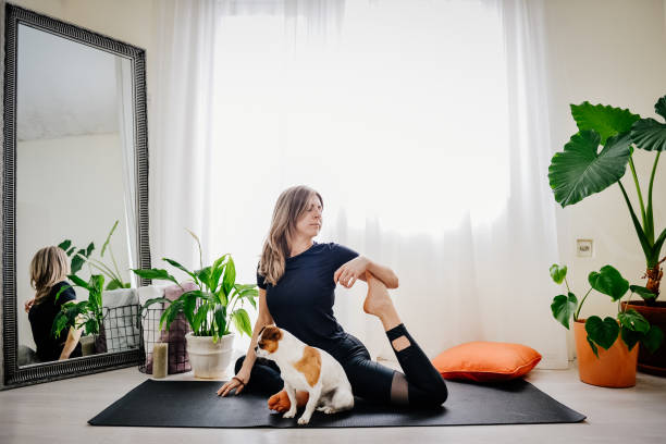 istock Young woman doing exercises at home 1392214416