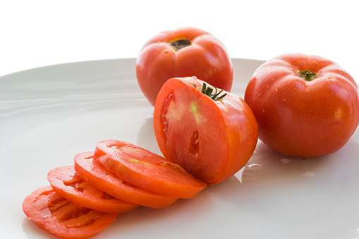 Fish tomatoes on a plate