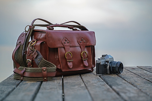 Handmade leather bag with vintage camera