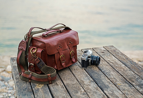 Handmade leather bag with vintage camera