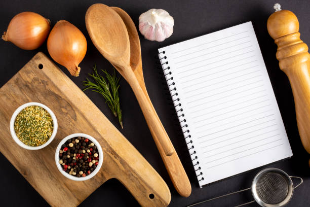 istock Cookbook with ingredients on the table.Recipe book. 1392224748