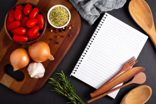 istock Cookbook with ingredients on the table.Recipe book. 1392224765