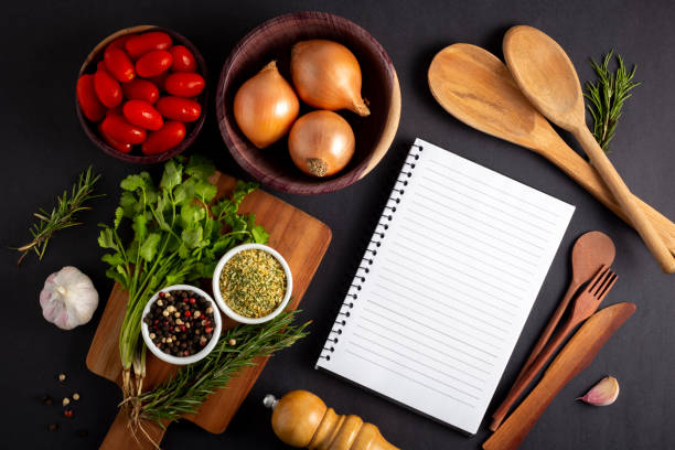 istock Cookbook with ingredients on the table.Recipe book. 1392224778