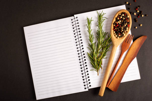 istock Cookbook with ingredients on the table.Recipe book. 1392224790