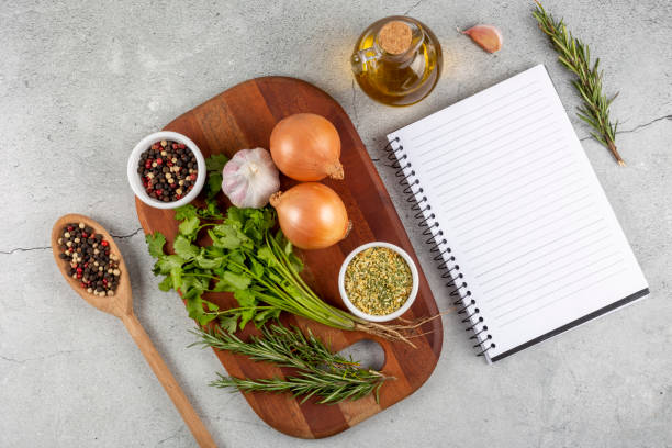 istock Cookbook with ingredients on the table.Recipe book. 1392224796