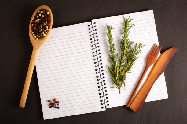 istock Cookbook with ingredients on the table.Recipe book. 1392224797