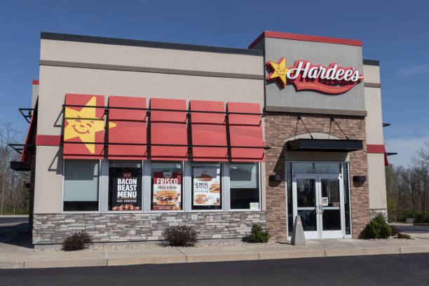 Hardee's fast food restaurant location. Hardee's is operated by CKE and the sister restaurant of Carl's Jr. Richmond - Circa April 2022: Hardee's fast food restaurant location. Hardee's is operated by CKE and the sister restaurant of Carl's Jr. curly fries stock pictures, royalty-free photos & images