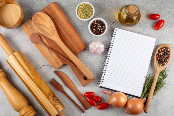 istock Cookbook with ingredients on the table.Recipe book. 1392224807